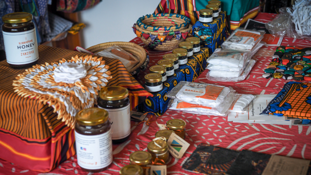 A variety of products produced by rural women trained by Barefoot College International sit on a market stall table