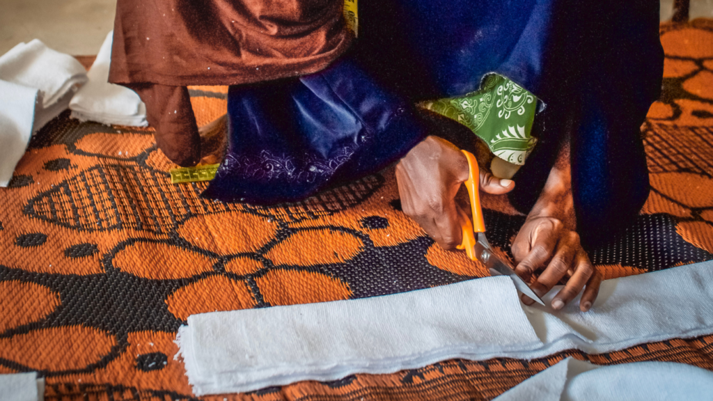 A woman in Zanzibar makes reusable sanitary towels at Barefoot College International through its livelihoods programme